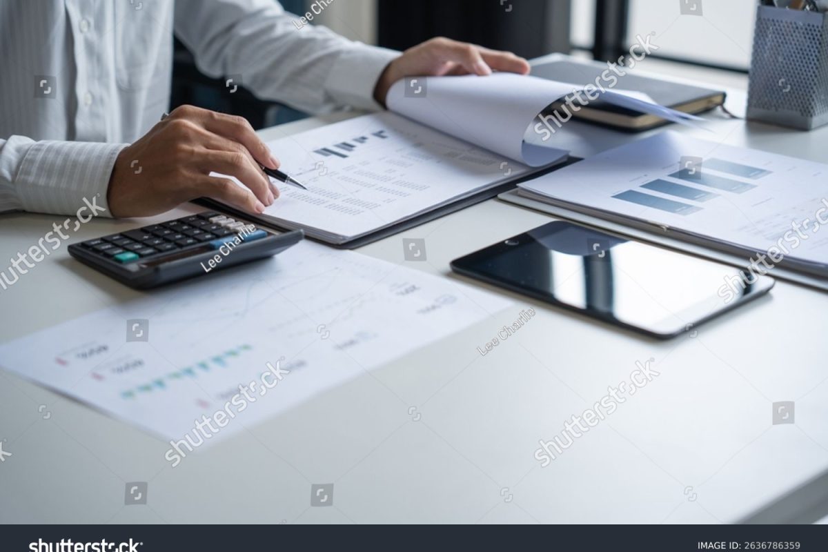 stock-photo-accountant-auditing-business-financial-records-2636786359