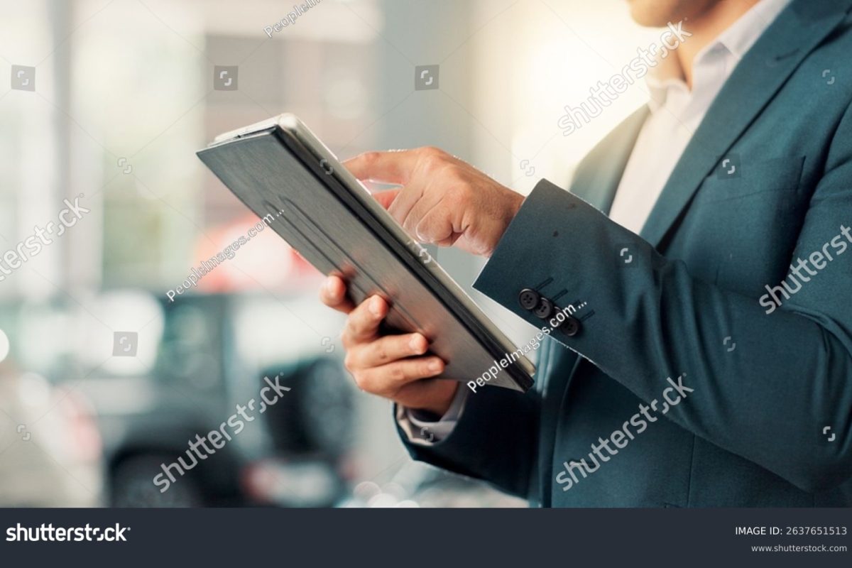 stock-photo-businessman-hands-and-scroll-with-tablet-for-car-dealership-reading-or-website-for-motor-rental-2637651513