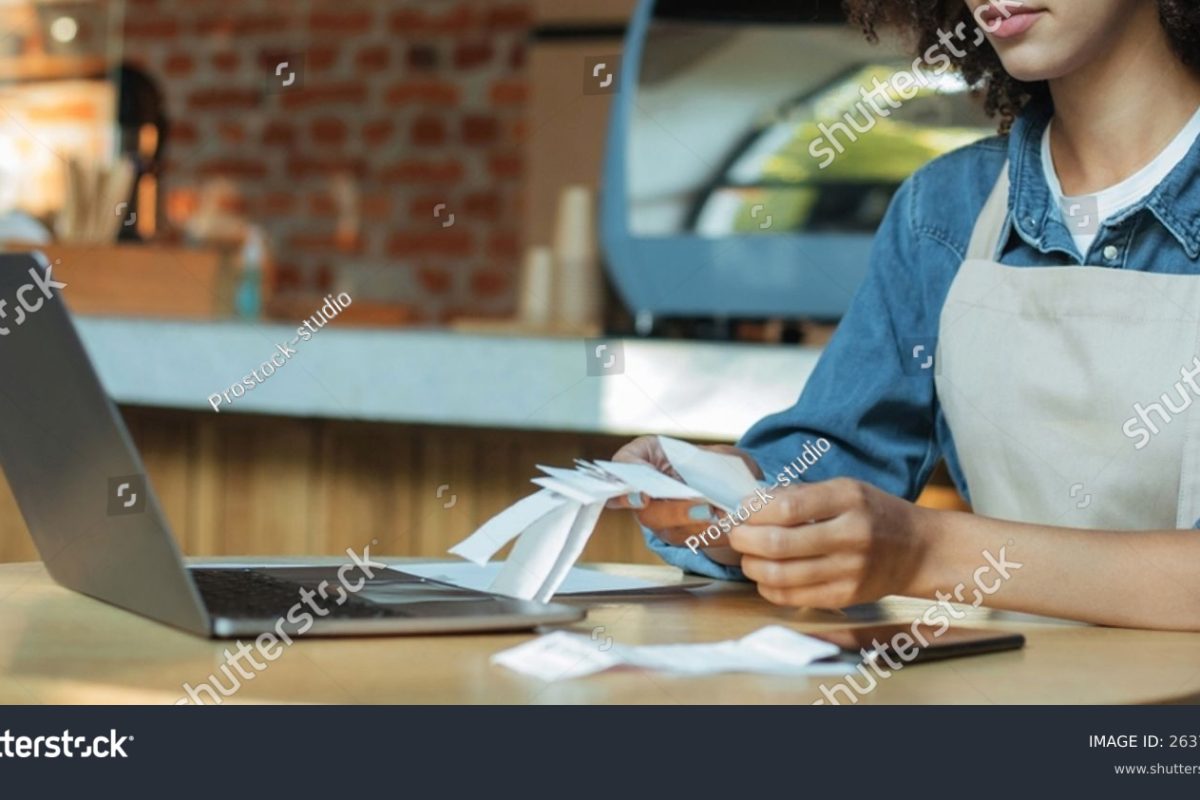 stock-photo-millennial-african-american-woman-owner-manager-in-apron-works-with-account-and-bookkeeping-in-cafe-2637259197